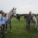 Parents holding the ponies